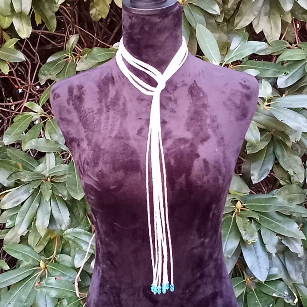 Beautiful and interesting necklace the beads are light blue